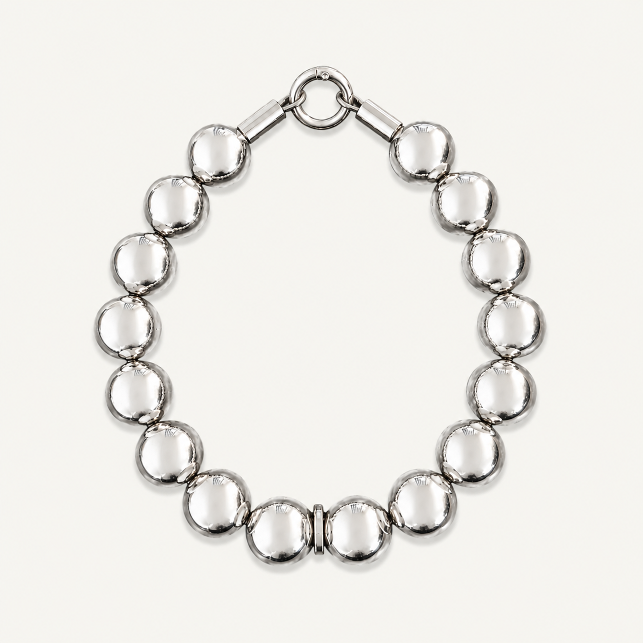 collar with silver beads and a white background