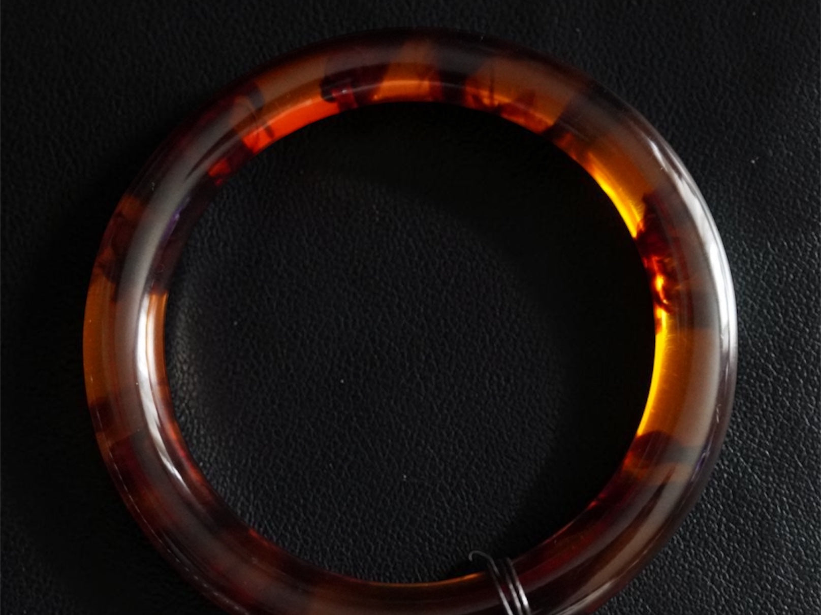 Tortoiseshell handle on a leather background