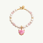 Pearl necklace with pink heart charm and 'BE MINE' text on a white background